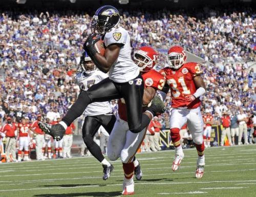 WR Mark Clayton hauls in a 31-yard touchdown pass over the Chiefs' Brandon Carr. The score put the Ravens ahead 31-24